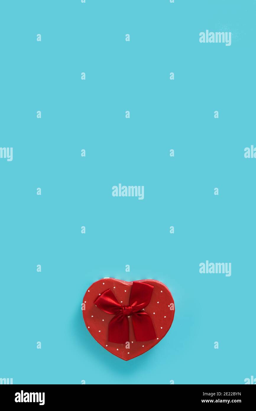 Heart shaped box on blue background Stock Photo