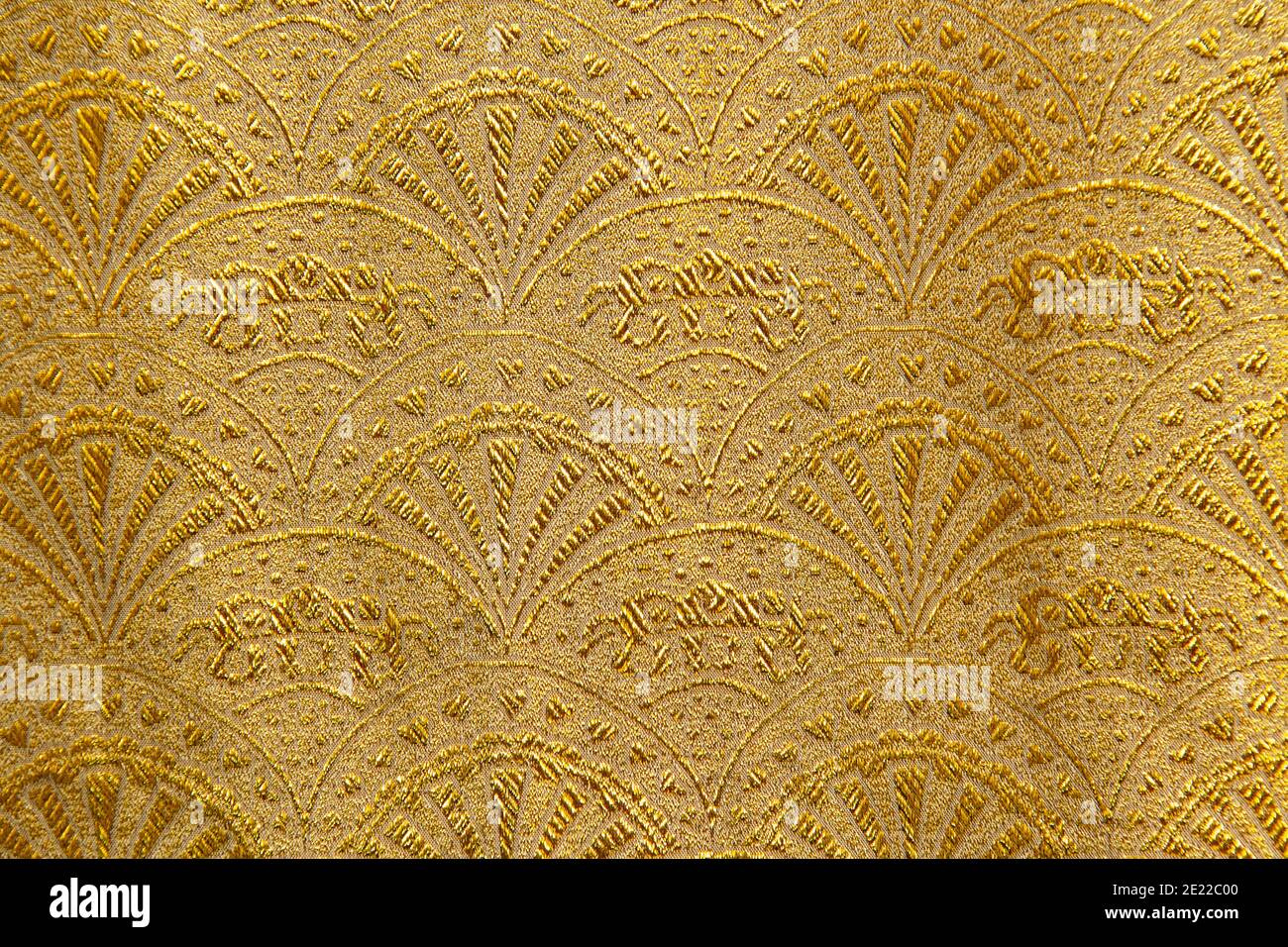 Gold floral ornament brocade textile pattern, beautiful expensive fabric background. Stock Photo