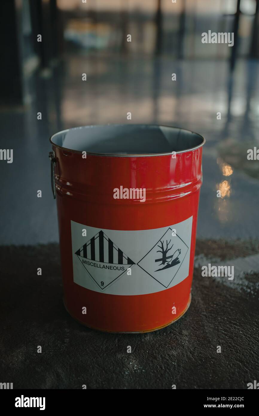 Tin bucket with toxic composition and epoxy resin inside Stock Photo
