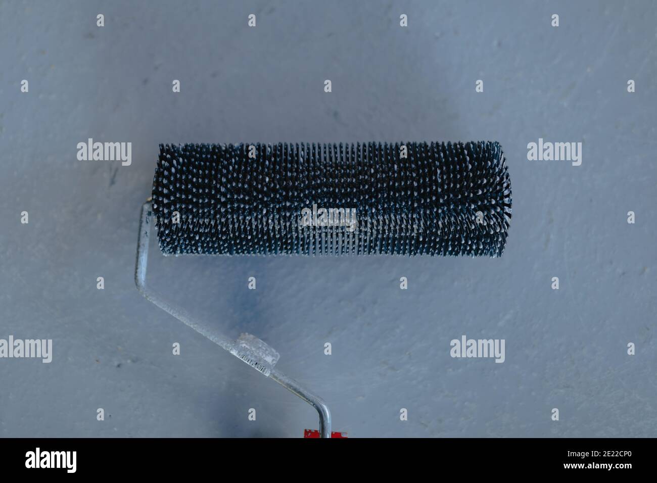 Needle roller for bubbles in the epoxy floor Stock Photo Alamy