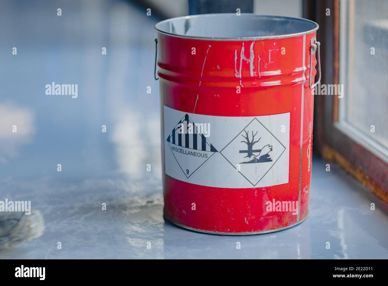 Tin bucket with toxic composition and epoxy resin inside Stock Photo
