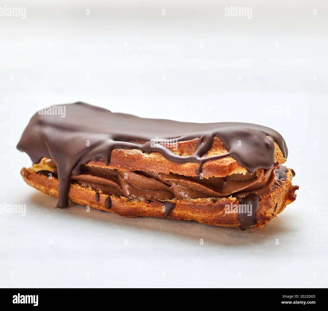 freshly baked eclair on white background Stock Photo