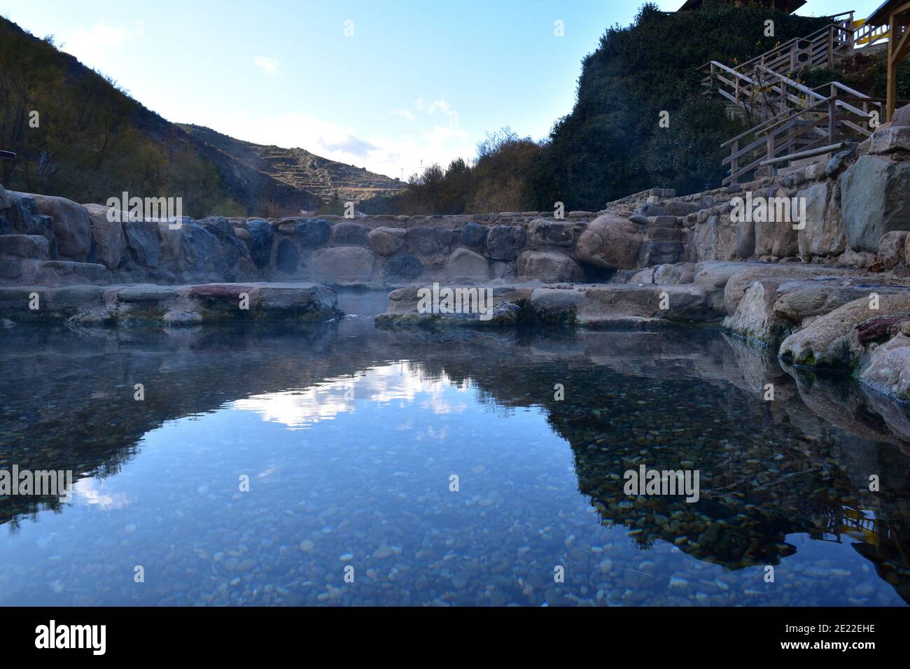 View of the Arnedillo thermal water pools from the height of the water. Hot springs in stone in the village of Arnedillo. Stock Photo