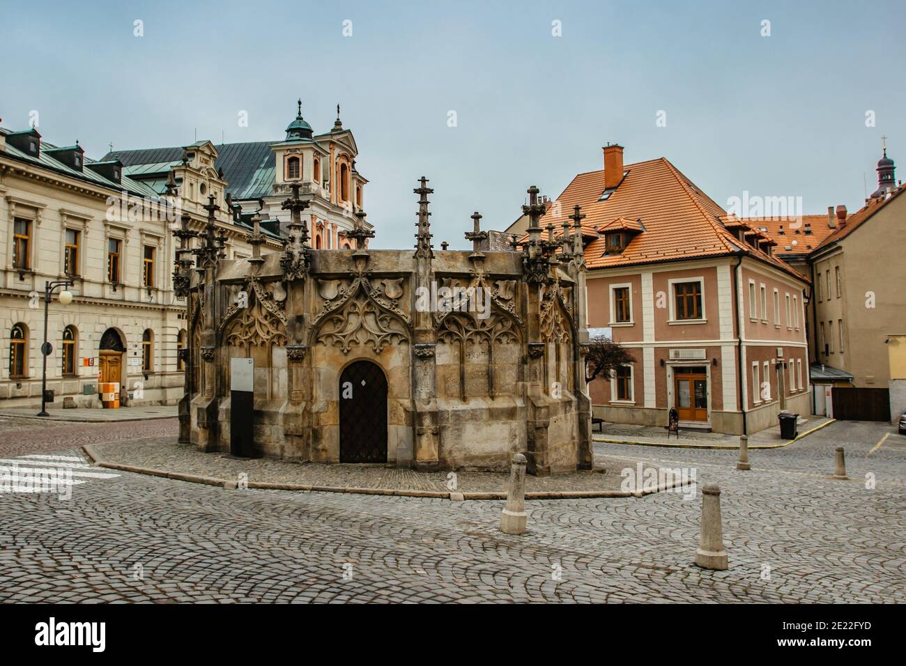 Stone Fountain in historical Town Center with cobblestone street, colorful facades, Kutna Hora, Czech Republic.UNESCO world heritage site. Stock Photo