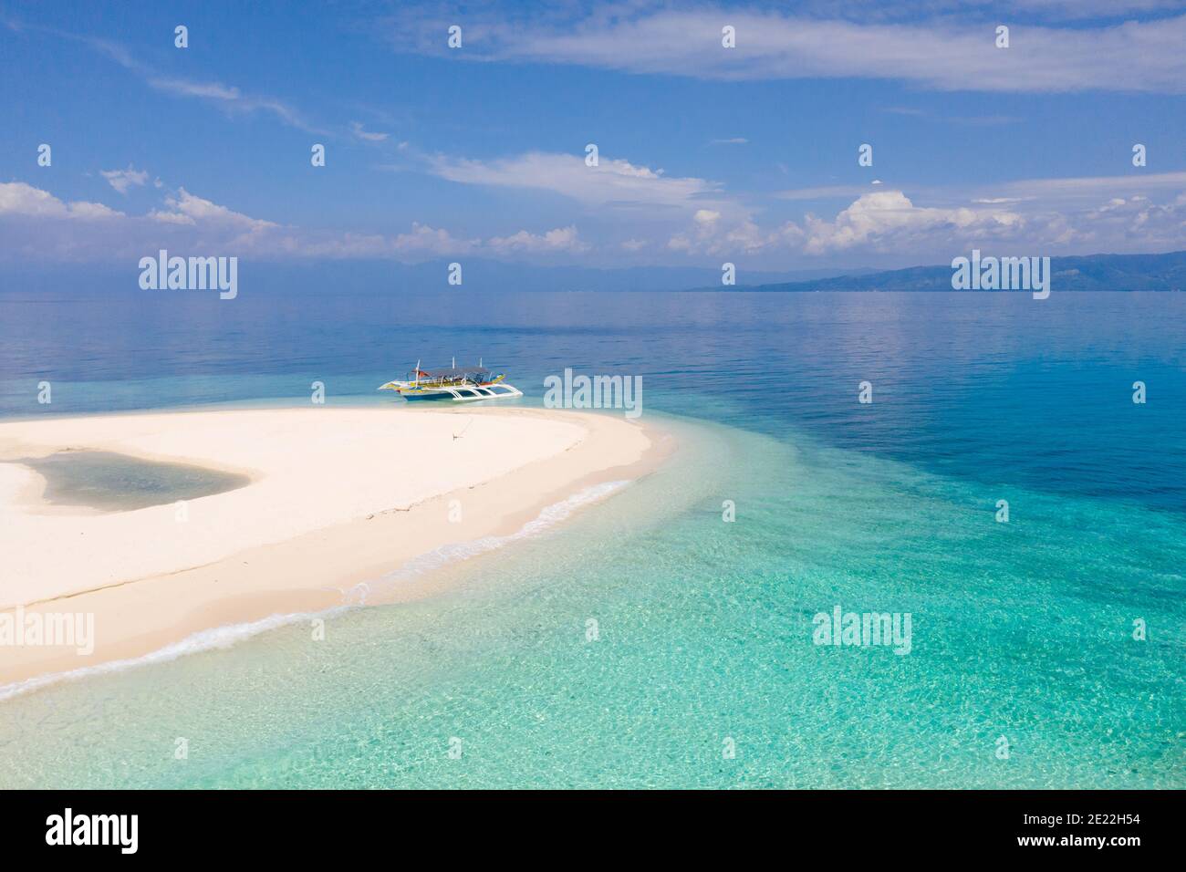 Tranquil beach scenery. Exotic tropical beach landscape with white sand beach and amazing turquoise sea. Digyo Island, Philippines. Stock Photo