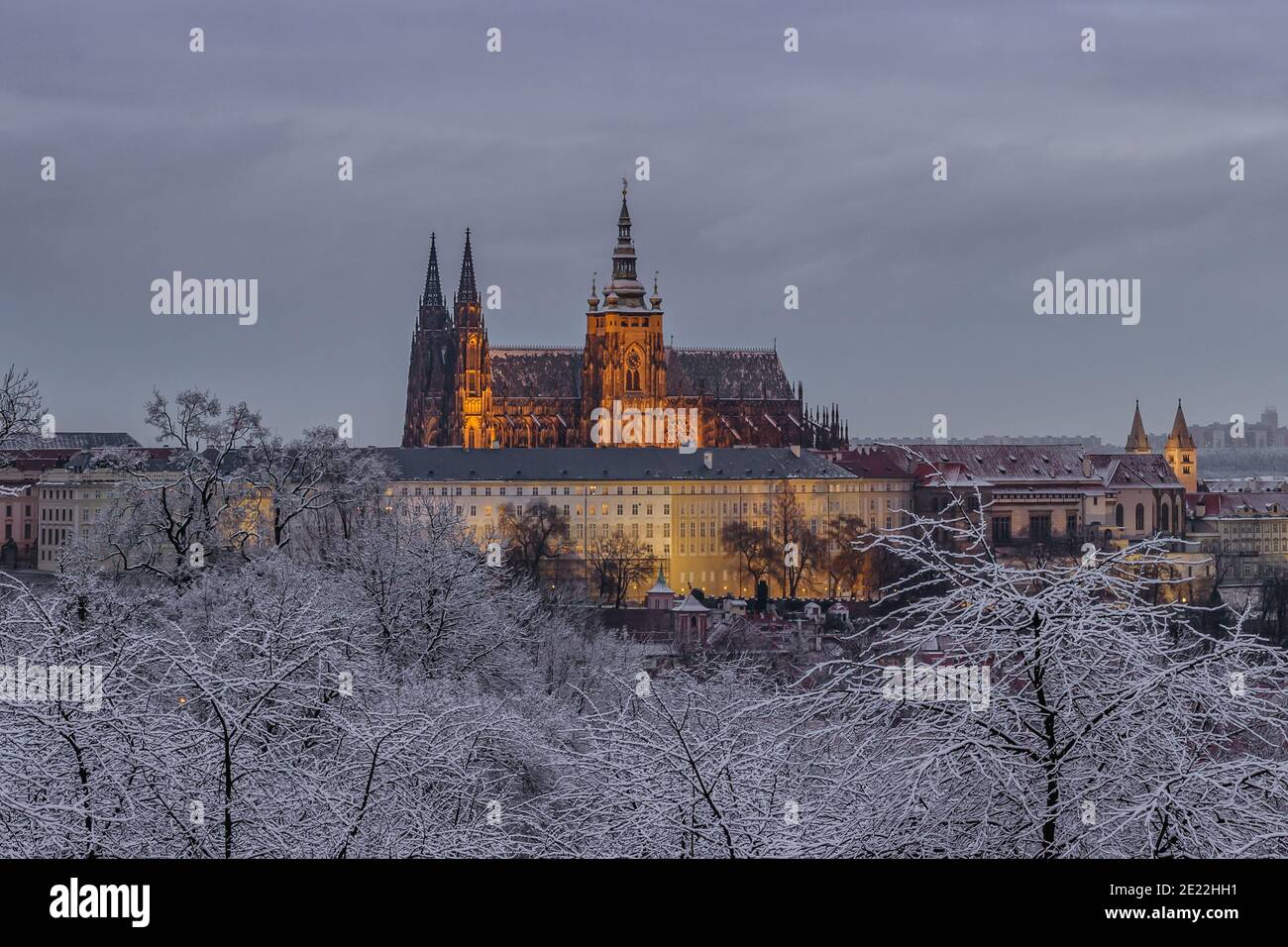 Postcard view of evening Prague Castle from Petrin, Czech republic.Famous tourist destination.Prague winter panorama.Snowy day in the city.Amazing Eur Stock Photo