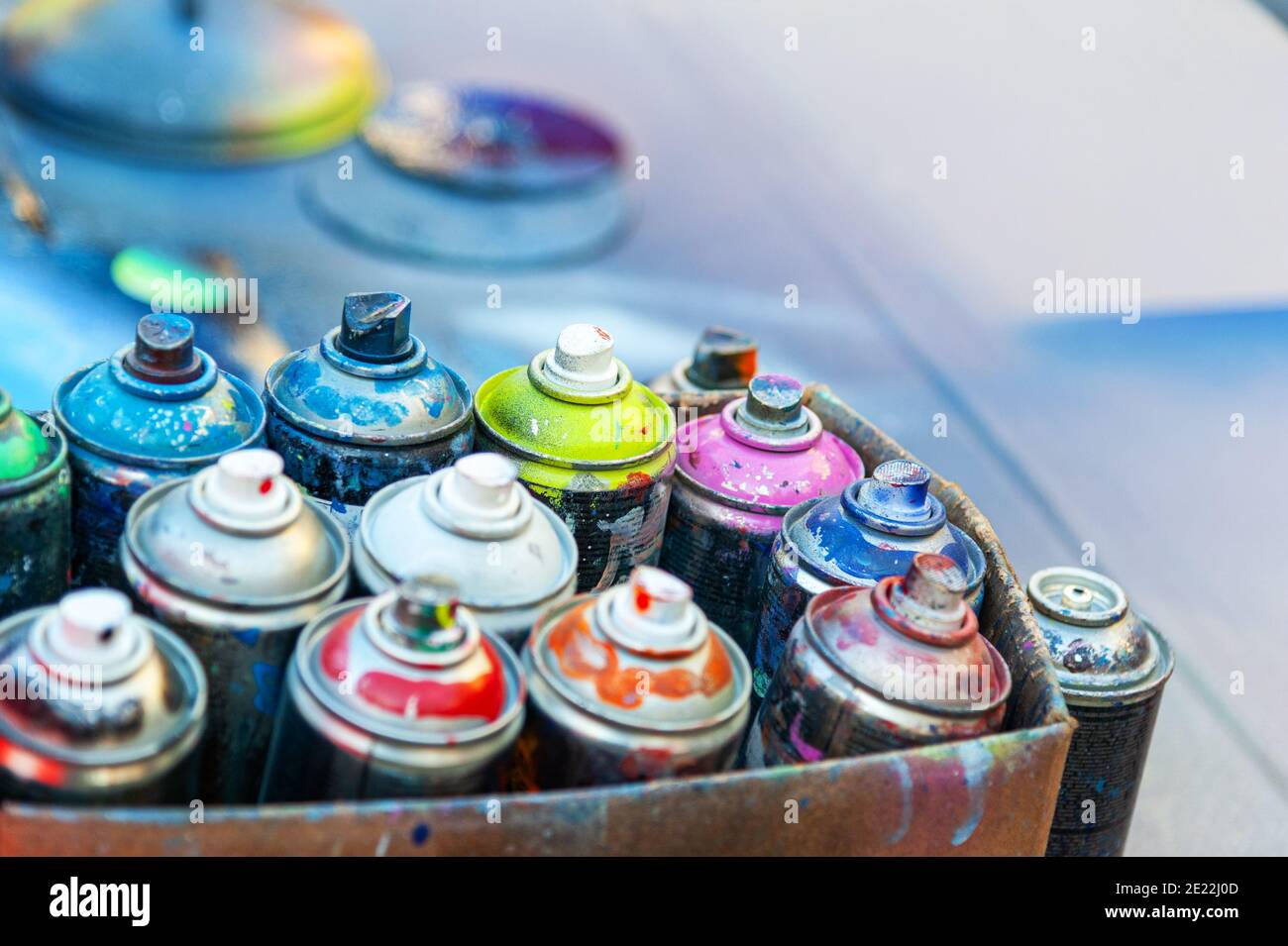Used aerosol spray paint in cans in carton Stock Photo Alamy
