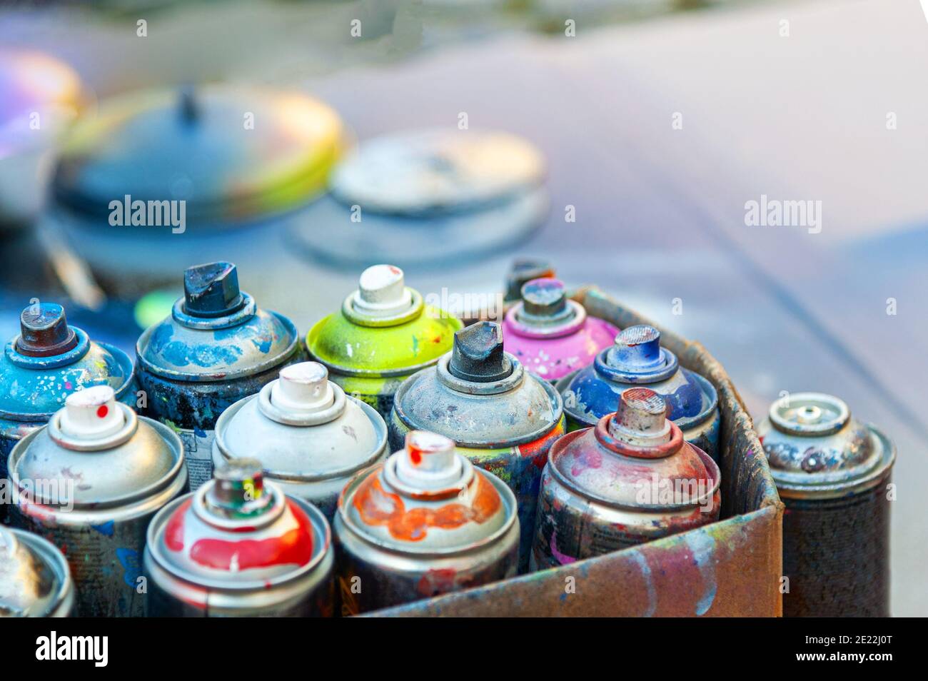 Used aerosol spray paint in cans in carton Stock Photo Alamy