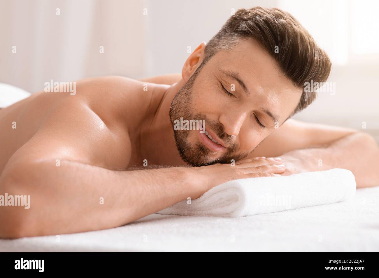 Relaxed middle aged man attending spa salon Stock Photo