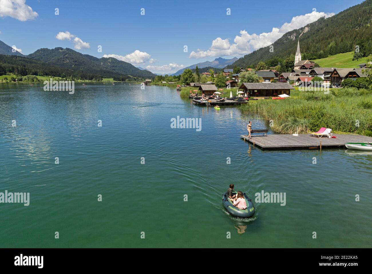 Glacial lake Weissensee / Weißensee and view over the village Techendorf in summer, district of Spittal an der Drau, Carinthia / Kärnten, Austria Stock Photo