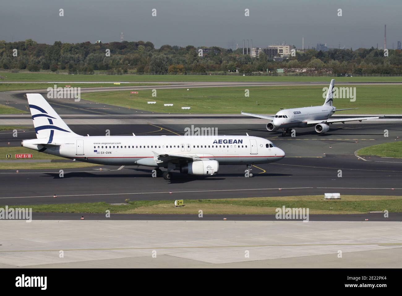 Greek Aegean Airlines Airbus A320-200 with registration SX-DVN together with SX-DVW on taxiway at Dusseldorf Airport. Stock Photo