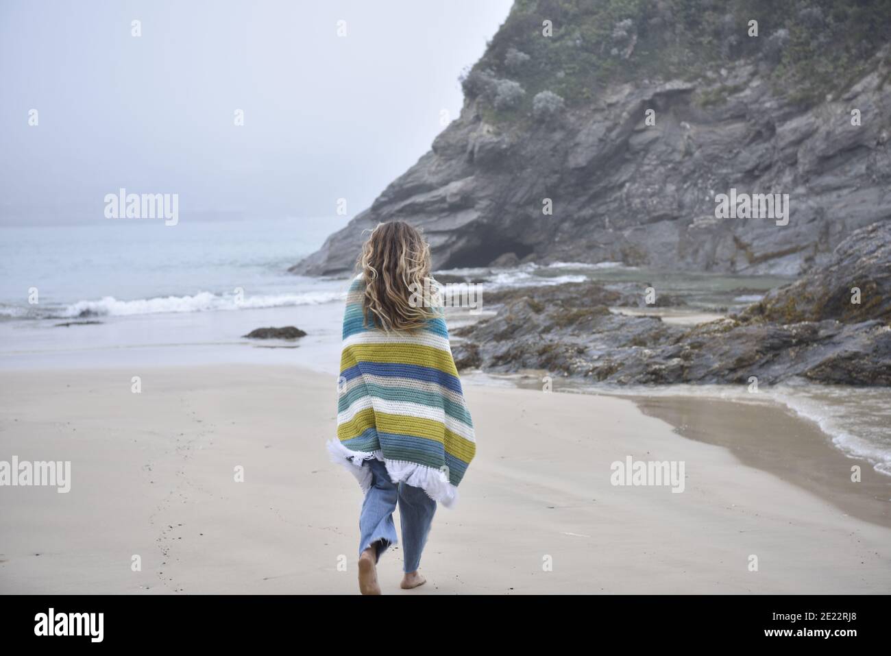 Girl on a beach in Cornwall Stock Photo