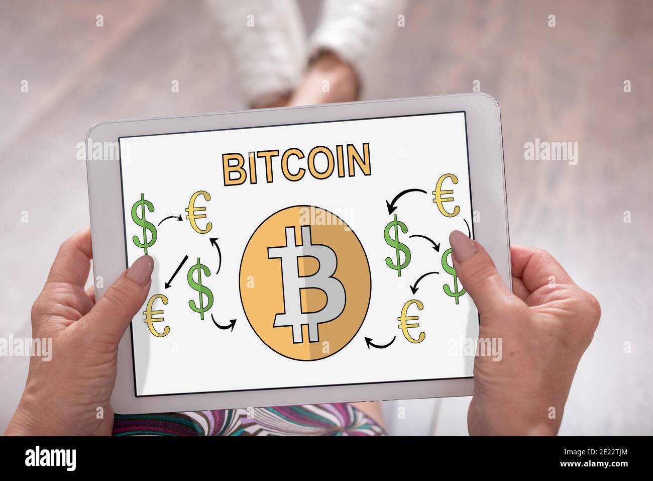 Bitcoin concept shown on a tablet held by a woman Stock Photo - Alamy