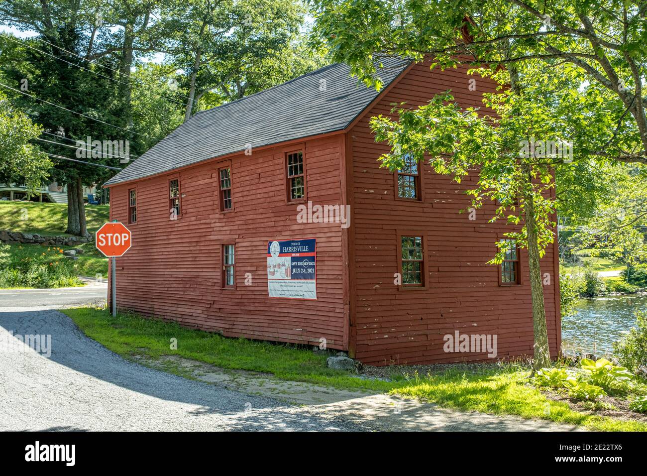 An old red barn on the common of Harrisville, New Hampshire Stock Photo