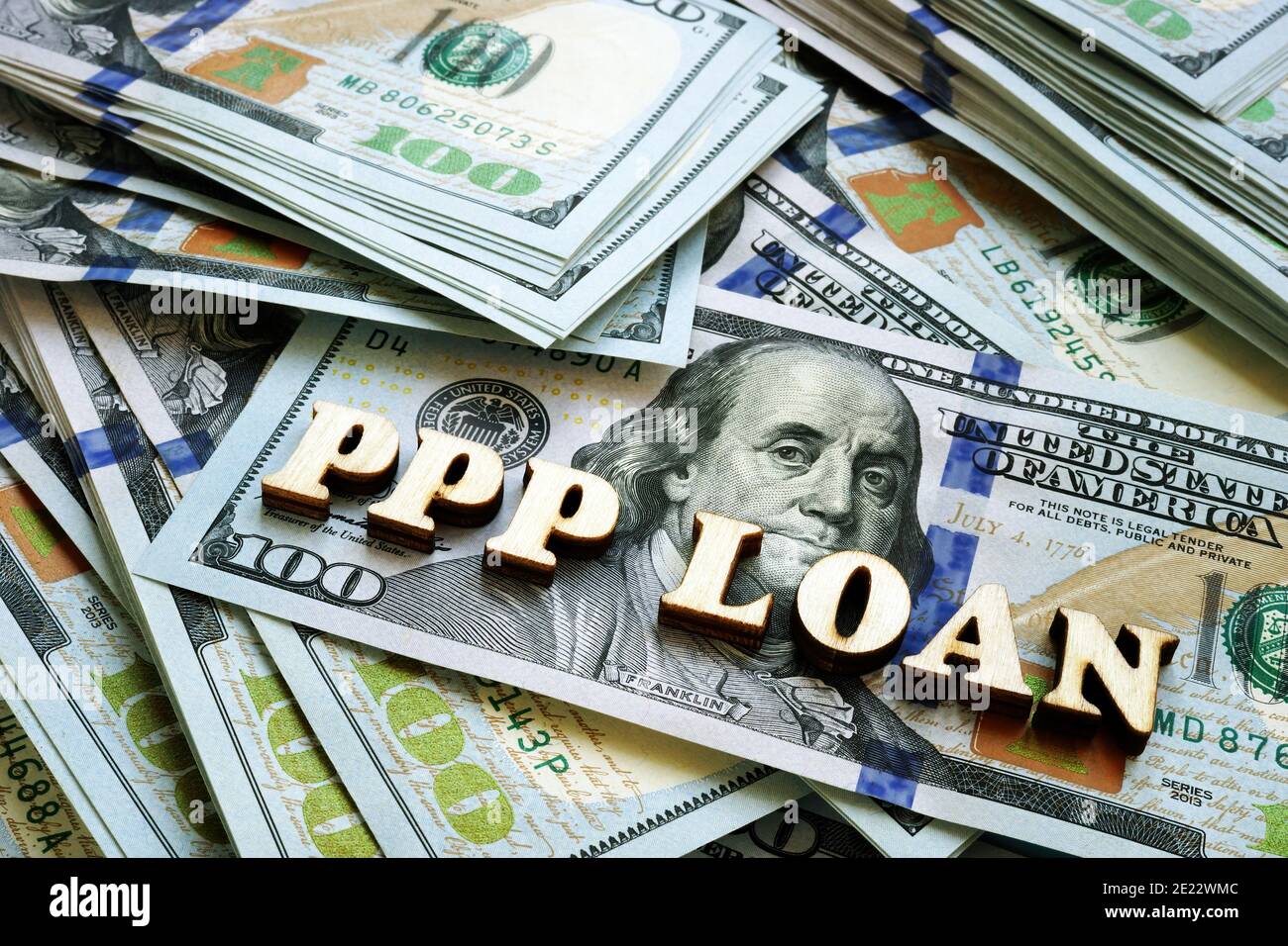 PPP loan letters on the cash. Paycheck Protection Program concept. Stock Photo