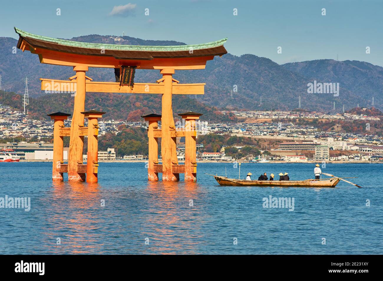 Miyajima, Hiroshima Prefecture, Japan - December 21, 2017: Itsukushima Shinto Shrine in Miyajima island with its floating red torii gate, UNESCO World Stock Photo