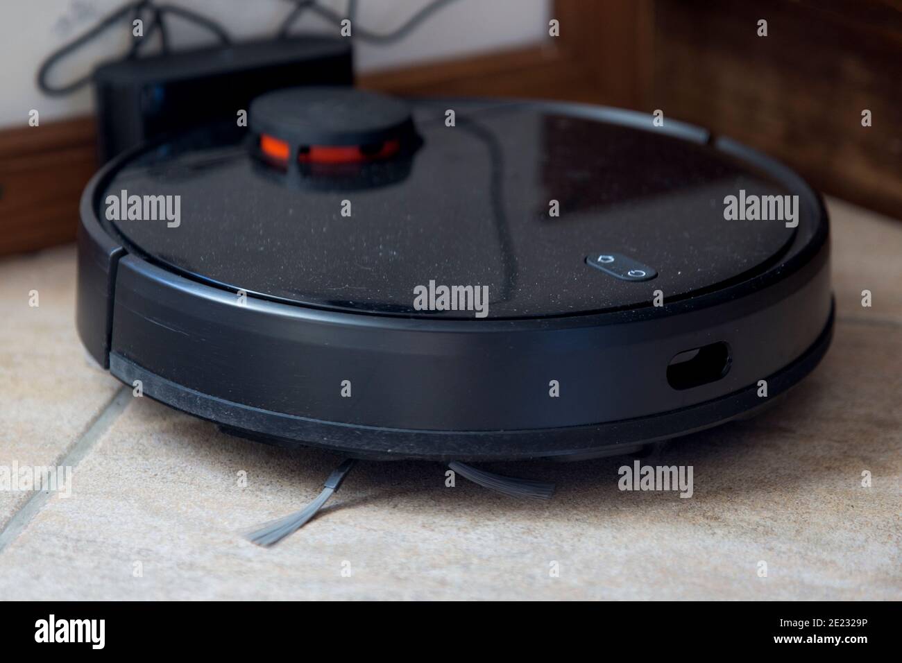 Side view of Robot vacuum cleaner on the floor, intelligent robotic