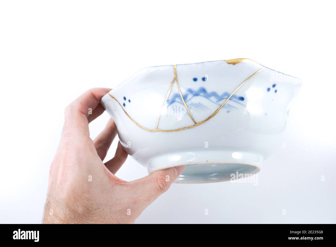 Antique Japanese Kintsugi bowl blue and white Stock Photo