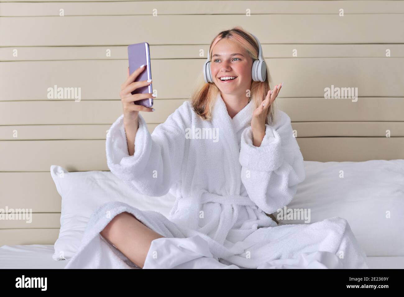 Online communication, video call, teenage girl in headphones with ...