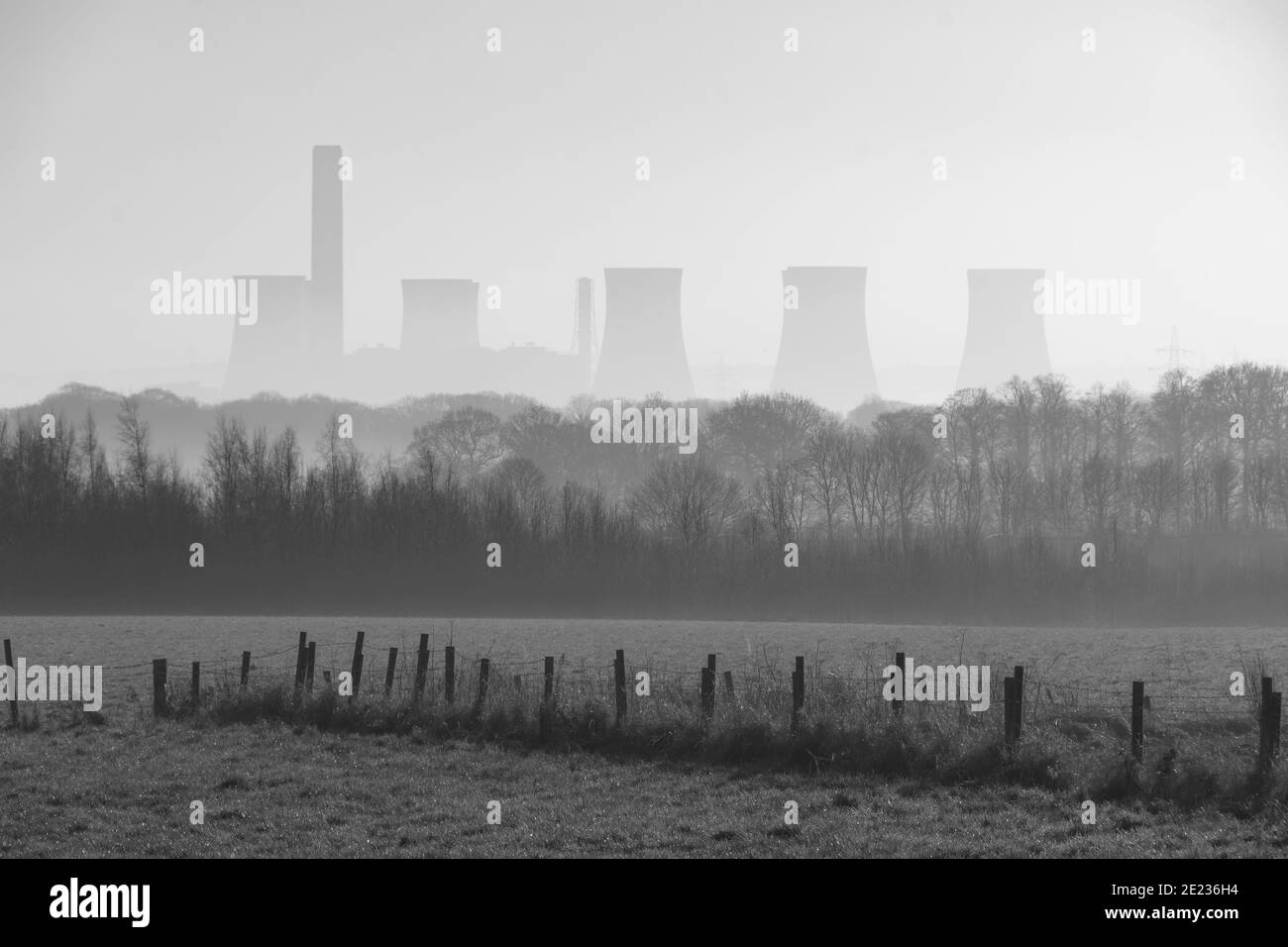 Fiddlers Ferry power station in mist looking from Clockface Country Park Stock Photo