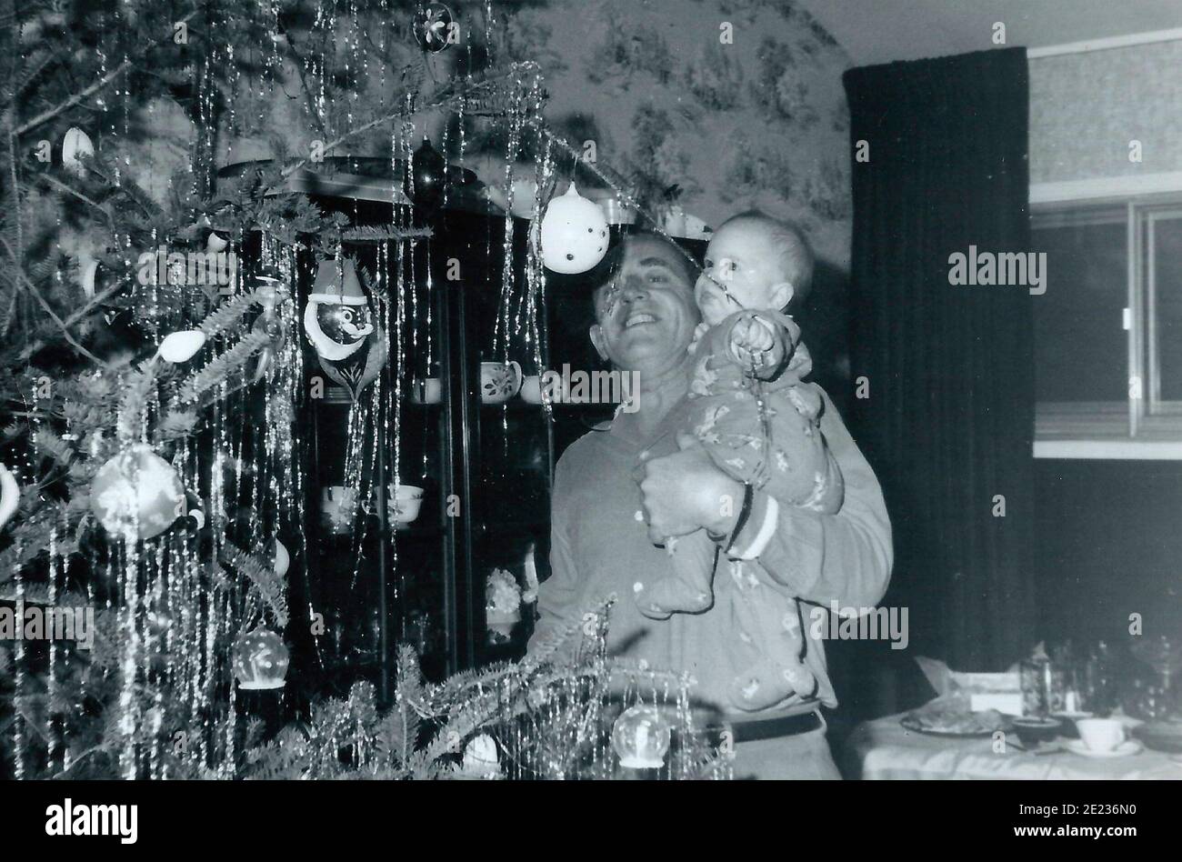 Putting up a Christmas Tree in 1960 Stock Photo