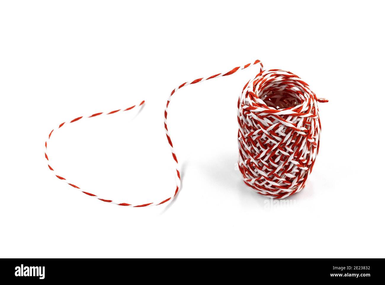 Red and white paper ribbon roll isolated on white background Stock
