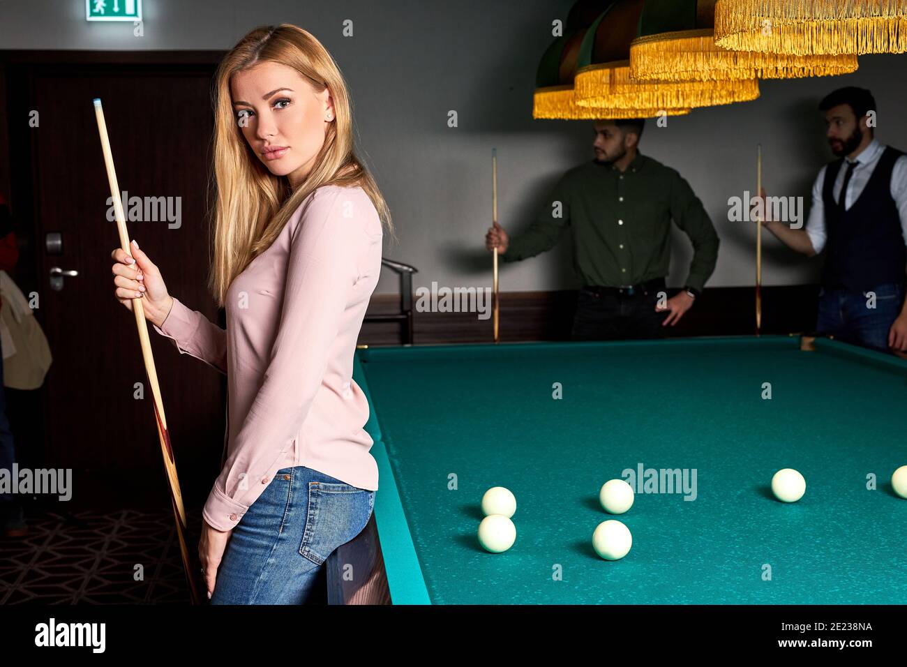 Premium Photo  Beautiful young girl came on a weekend to play billiards  for curiosity concept of a girl playing billiards