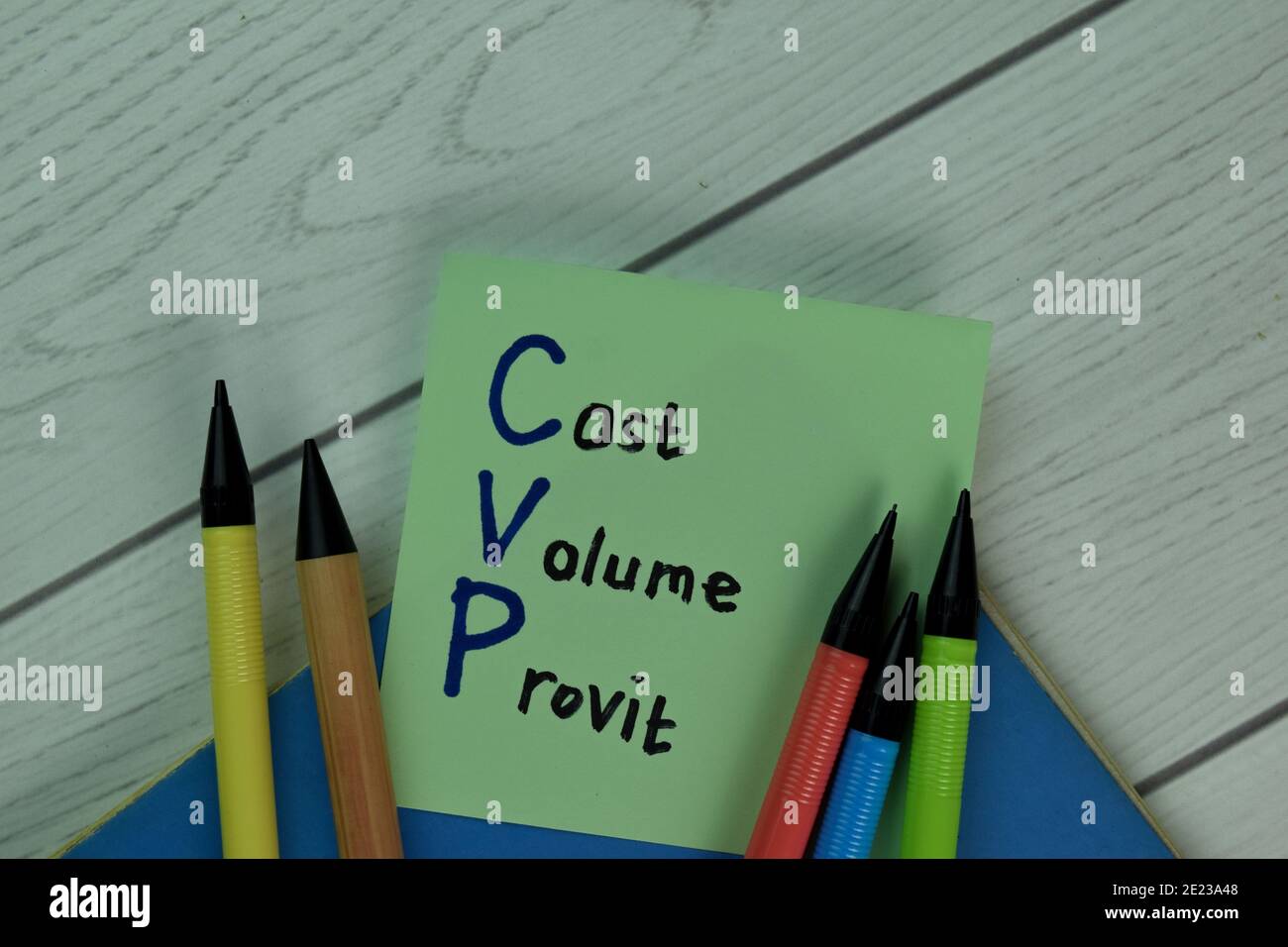 Cost Volume Provit write on sticky notes isolated on Wooden Table. Stock Photo