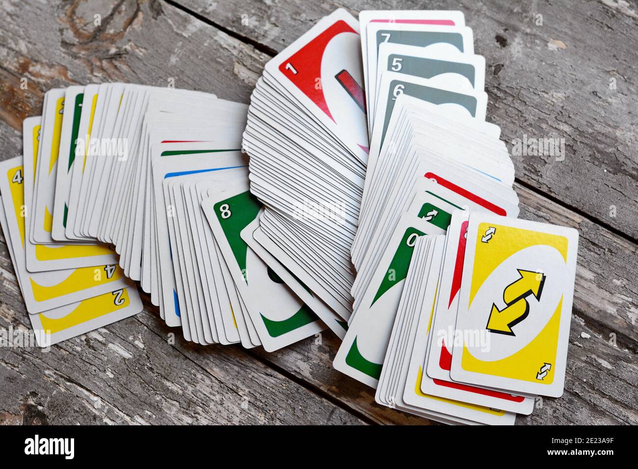 Deck of Uno Game Cards Scattered All Over on a Table. American