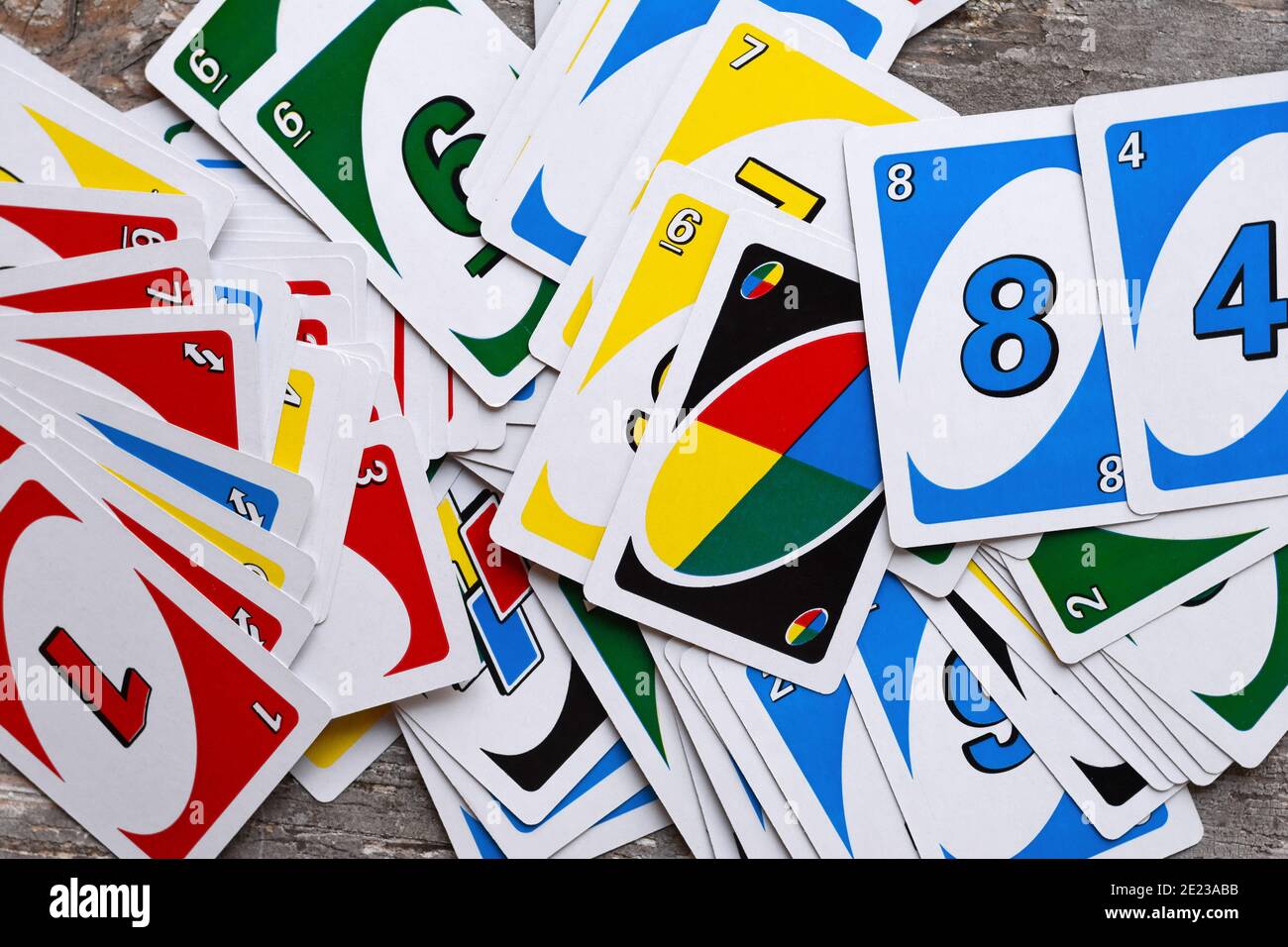 Deck of Uno Game Cards Scattered All Over on a Table. American