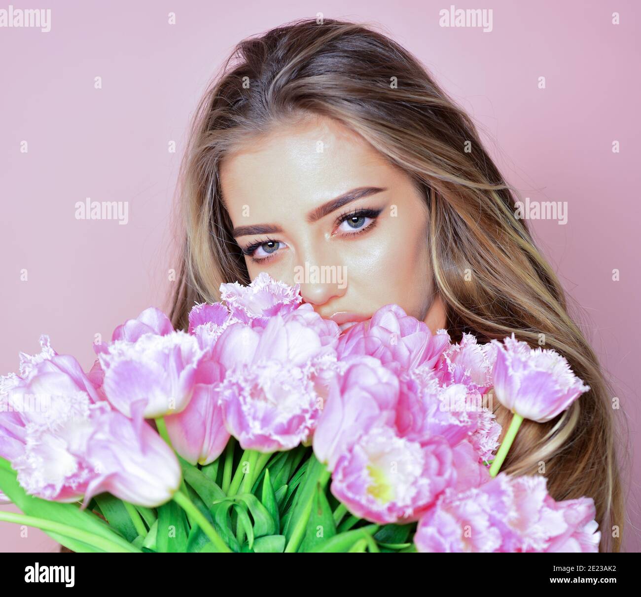 Spring girl with flowers. Portrait of a beautiful fashion woman. Face close-up Stock Photo