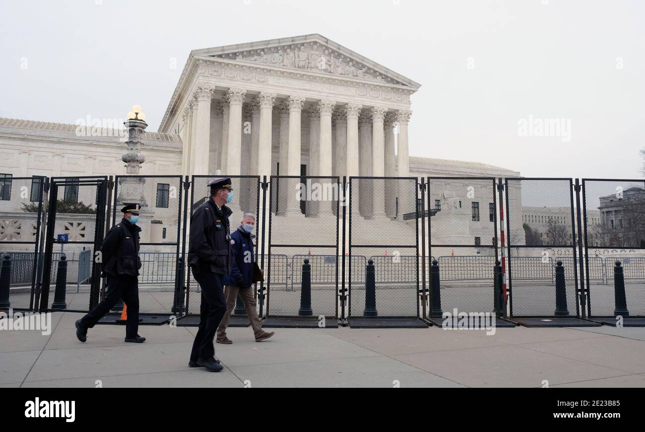 Fencing and barricades are erected around Capitol Hill after President Trump supporters stormed the Capitol Building protesting the election result. Stock Photo