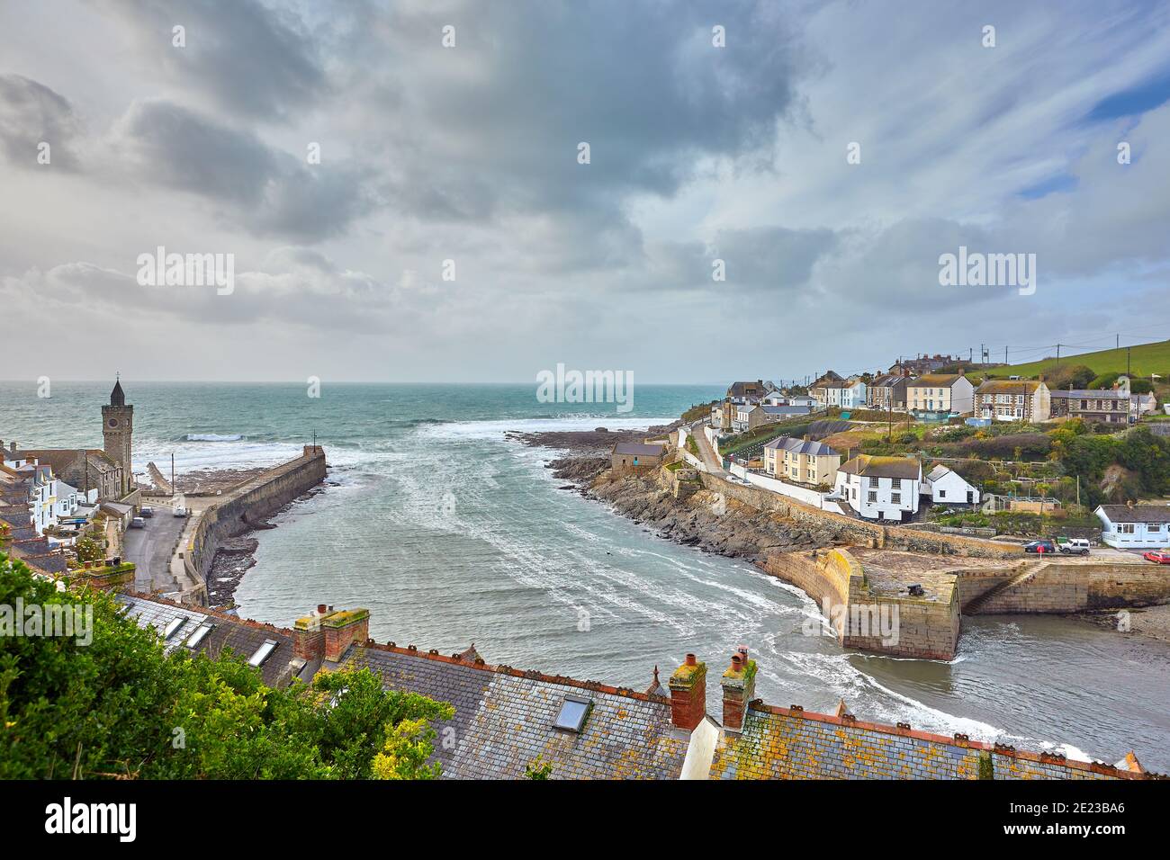Image of the outer part of the harbour at Porthleven, Cornwall with the breakwater and a cloudy sky Stock Photo
