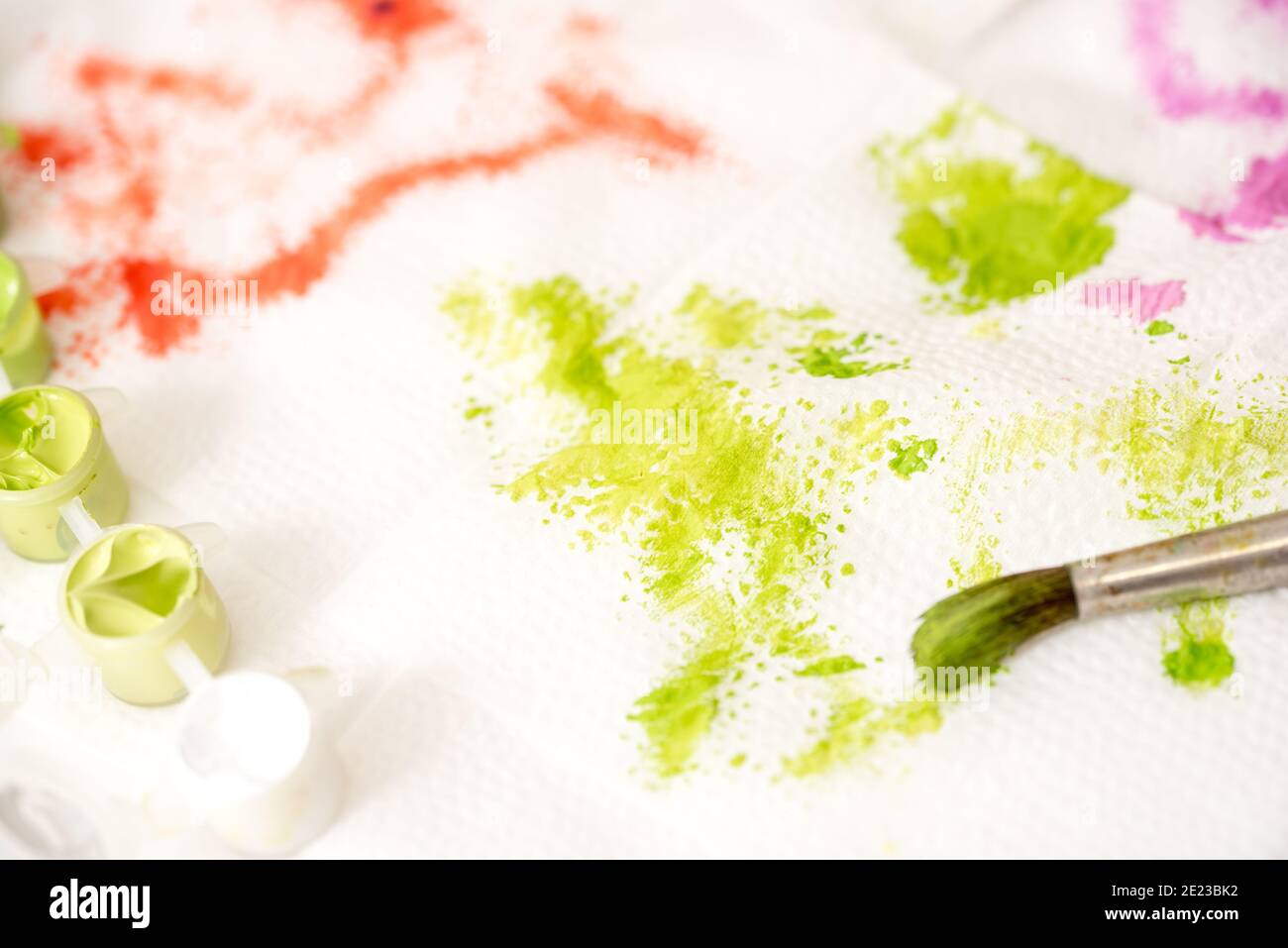 Abstract watercolor hand painted background. Green stain of paint on a white napkin Stock Photo