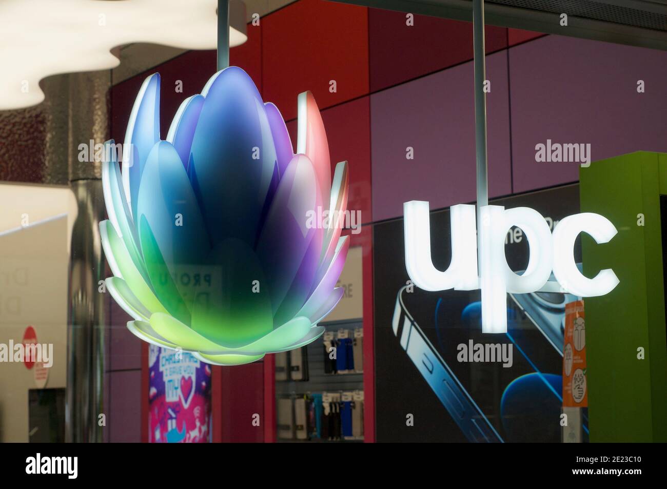 Lugano, Ticino, Switzerland - 5th January 2020 : Luminous UPC Cablecom logo  and sign hanging on a store front in Lugano. UPC is the largest cable oper  Stock Photo - Alamy