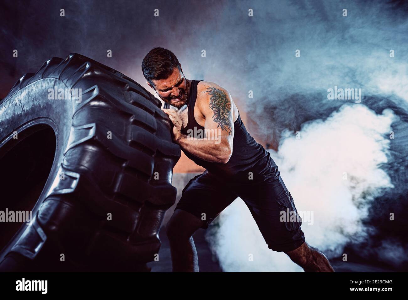 Bodybuilding training, bearded strong sportsman with muscular body