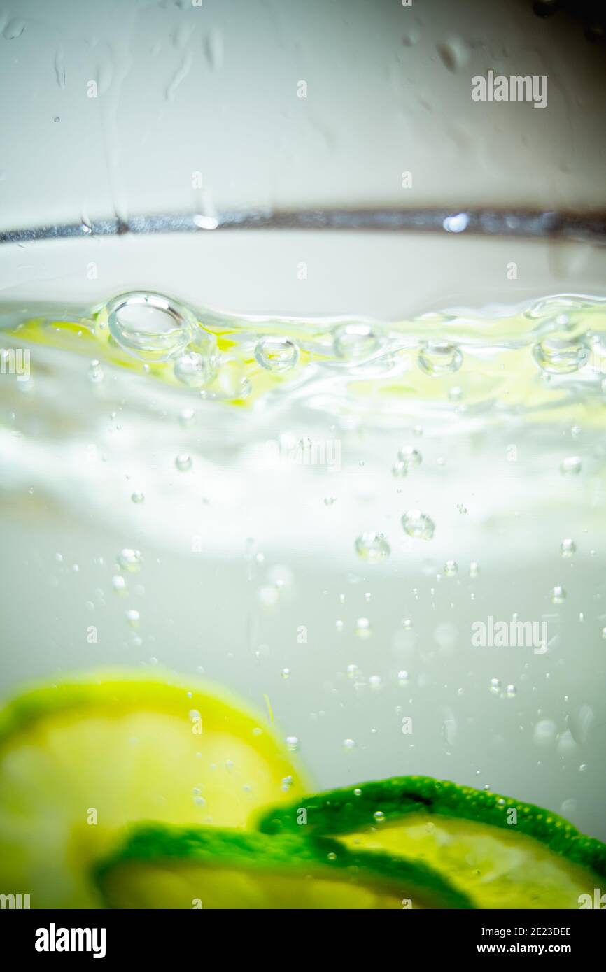 Lime in a glass of water. Stock Photo