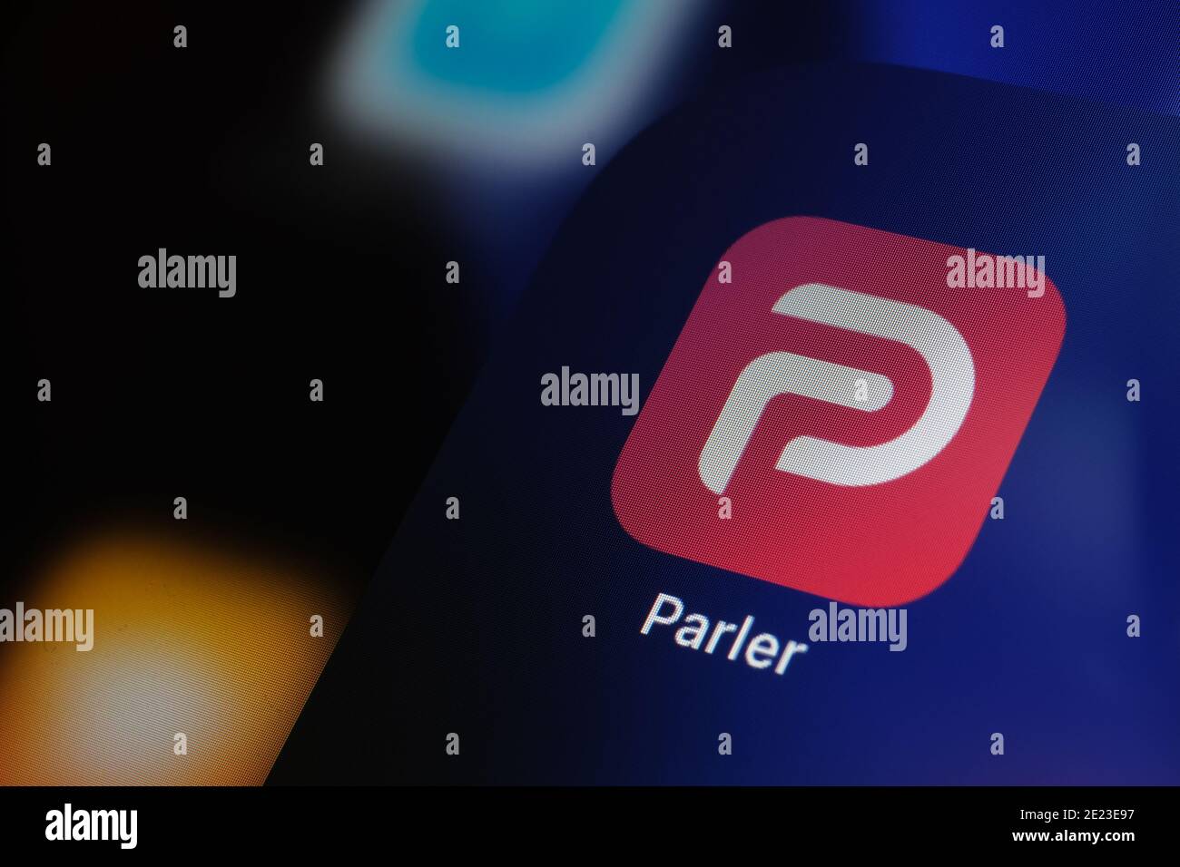 Parler app logo seen on the screen of iPad. Parler is a social media platform banned in the US. Stock Photo