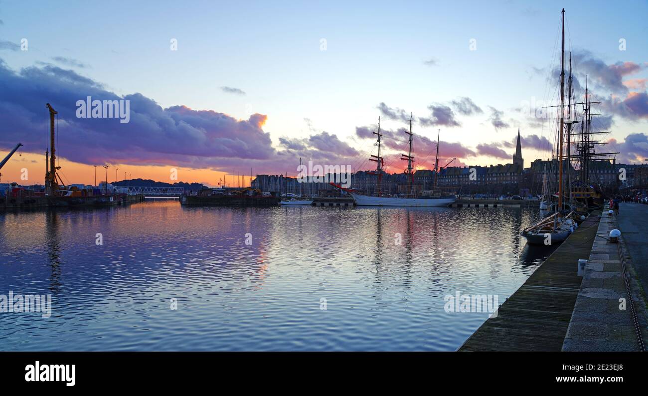 SAINT MALO, FRANCE -1 JAN 2021- Colorful sunset sky over boats in winter in Saint Malo, Brittany, France. Stock Photo