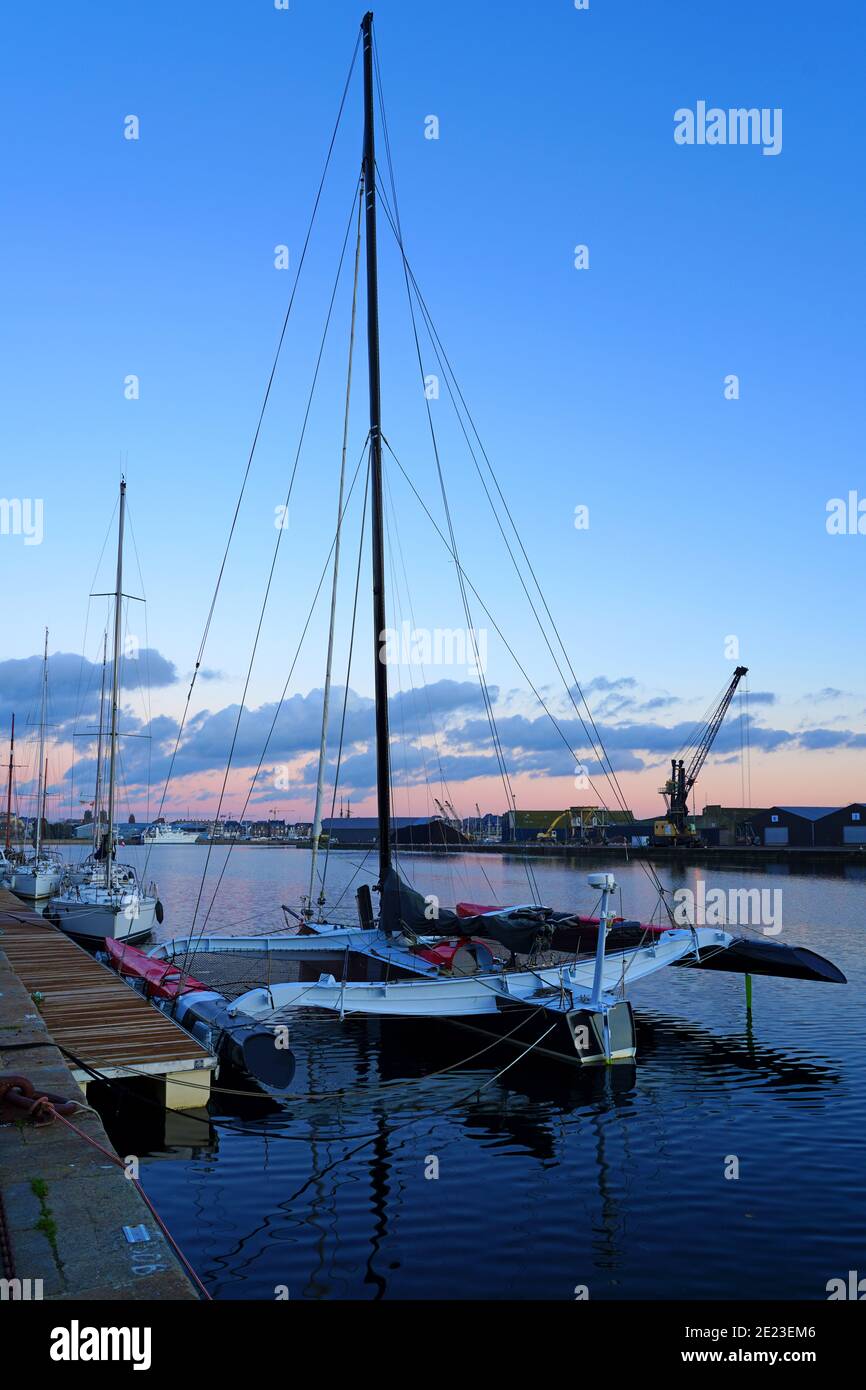 SAINT MALO, FRANCE -1 JAN 2021- Colorful sunset sky over boats in winter in Saint Malo, Brittany, France. Stock Photo