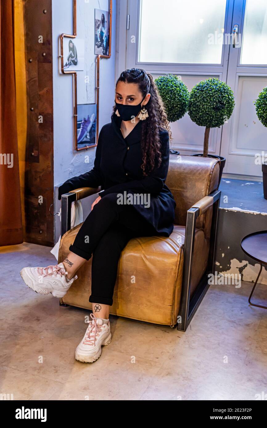 Female model sitting on chair hi-res stock photography and images - Alamy