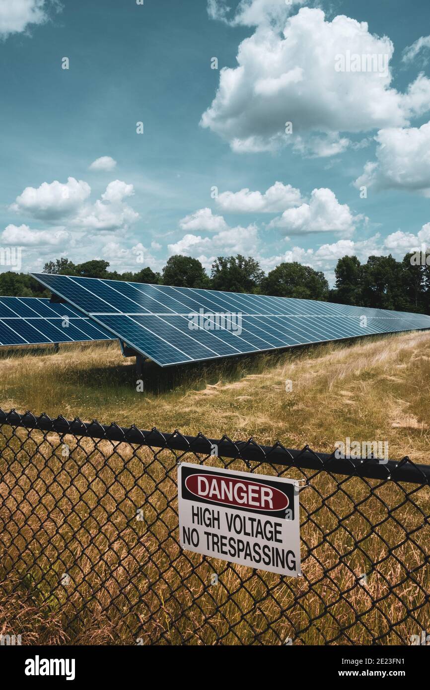 Solar Arrays with High Voltage Sign, Lapeer, Michigan, USA Stock Photo