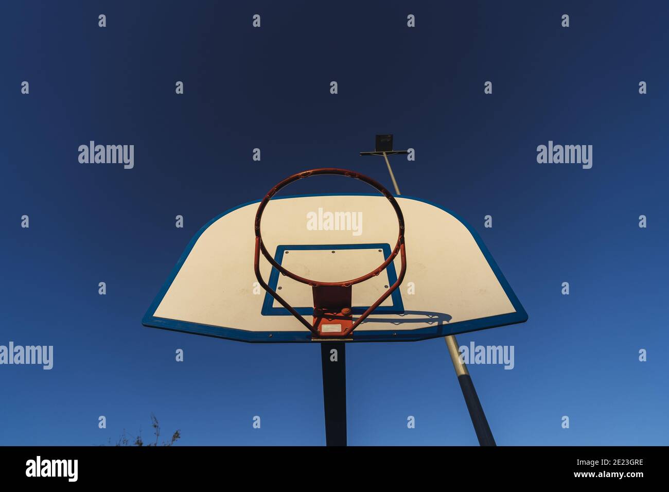 Low angle shot of a basketball hoop without a net Stock Photo Alamy