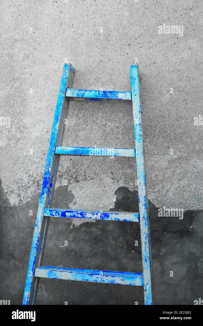 Blue wooden ladder and rough wall texture Stock Photo - Alamy