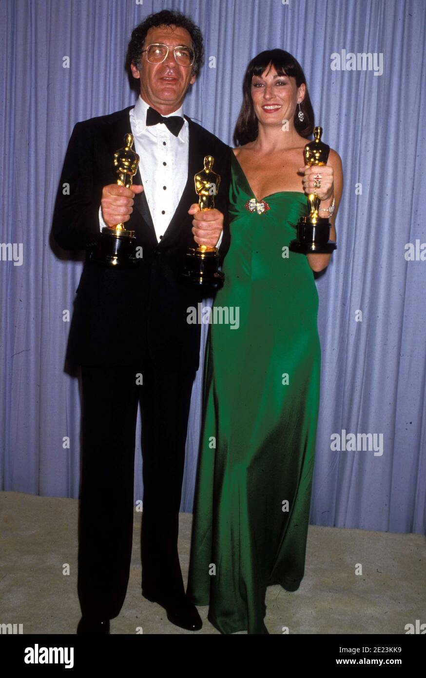 Sydney Pollack And Anjelica Huston at the 58th Annual Academy Awards March 24, 1986.   Credit: Ralph Dominguez/MediaPunch Stock Photo