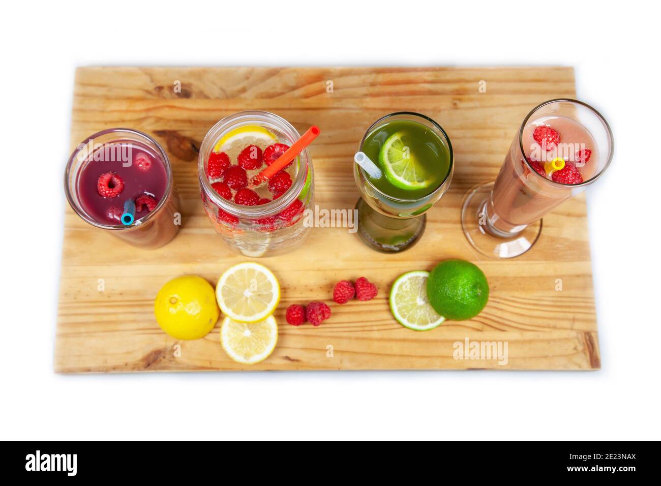 A serving platter with four drinks and smoothies lined up using food-grade, silicone straws that are reusable, and a plastic alternative to be sustain Stock Photo