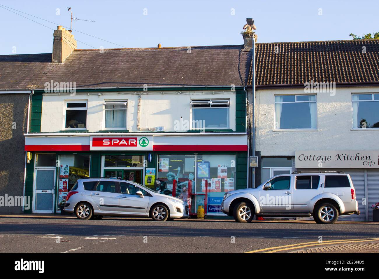 29 June 2018 A small Spar grocery store outlet open for business in Groomsport County Down while the local cafe remains closed on a warm summer evenin Stock Photo