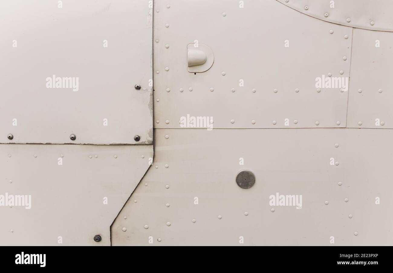 Rivet Rash Aluminum surface of the aircraft fuselage. Smooth rows of rivets, there ...
