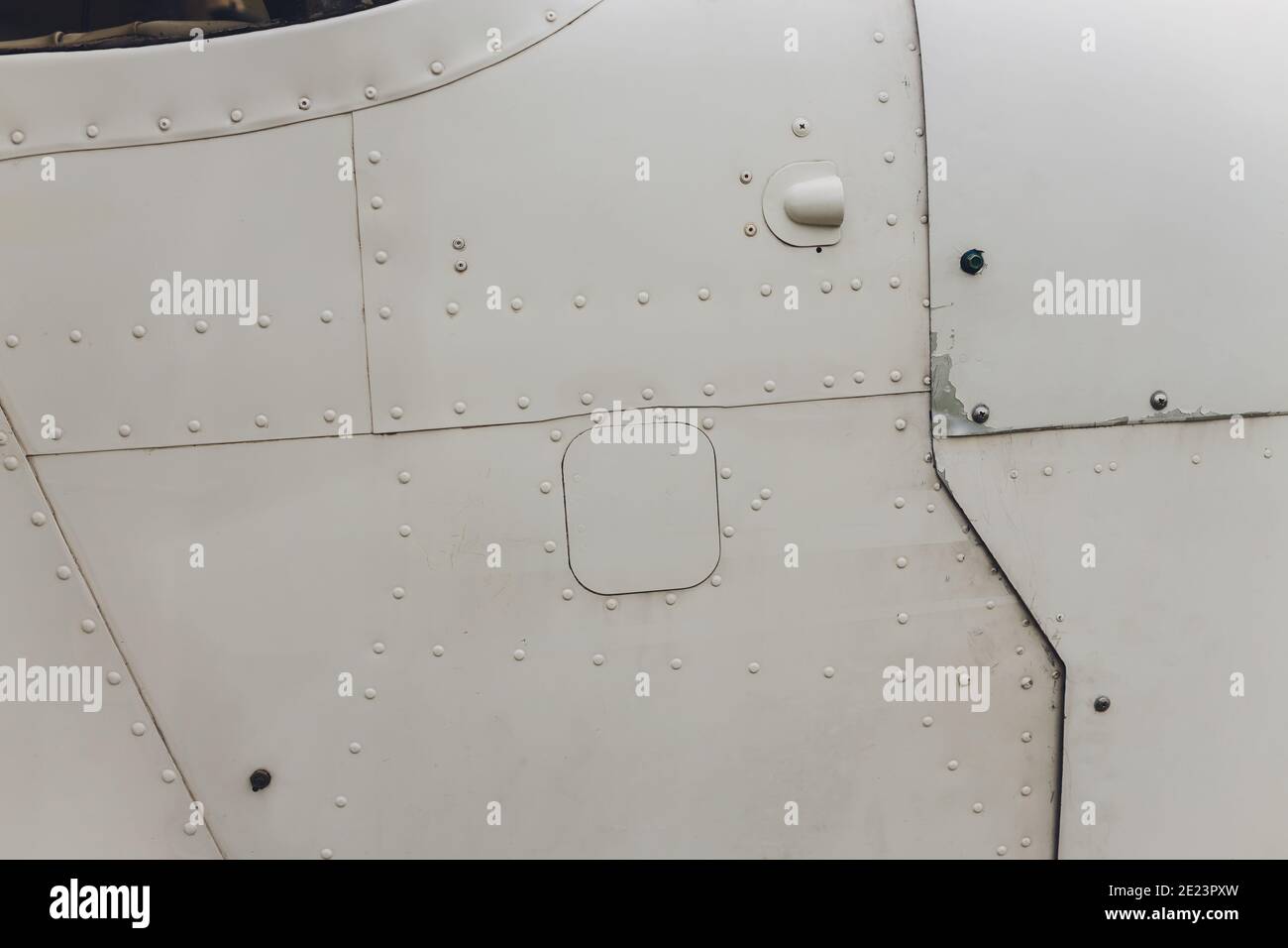 Rivet Rash Aluminum surface of the aircraft fuselage. Smooth rows of rivets, there ...