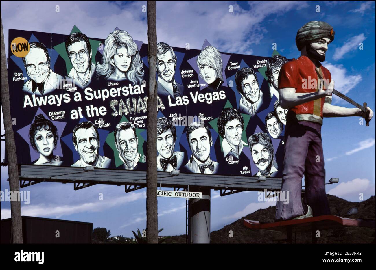 A billboard on the Sunset Strip in Los Angeles promotes travel to the Sahara Hotel in Las Vegas with Superstar performers circa 1979. Stock Photo